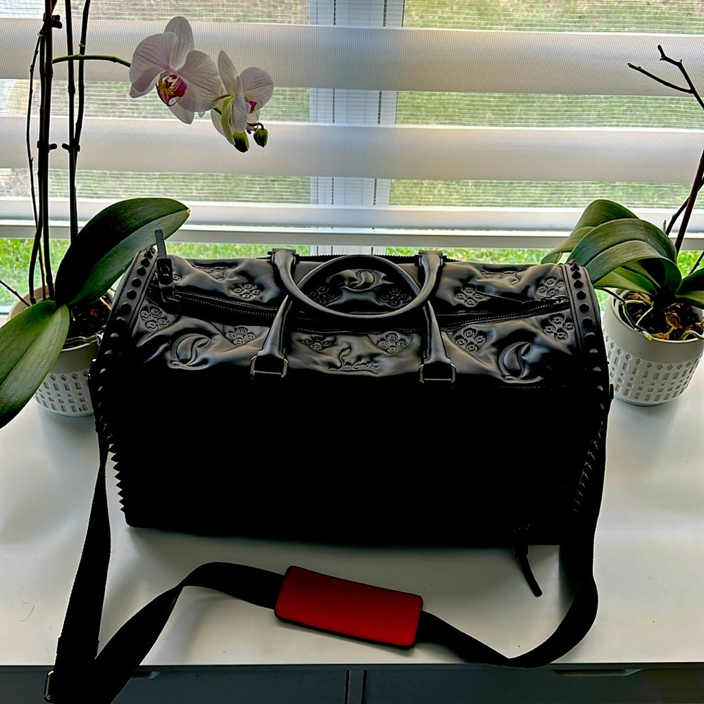 Sneakender by Christian Louboutin black leather, red lining, stud details